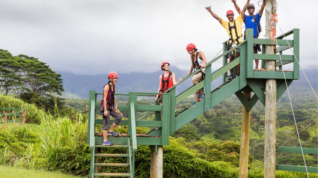 people zip lining as a group having fun